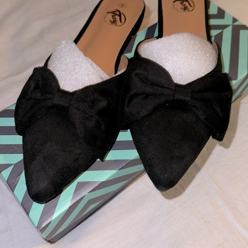 Black suede flats with bow
